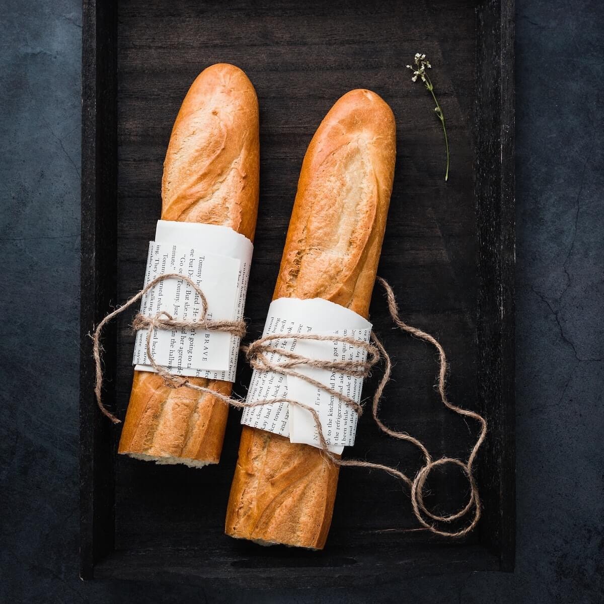 two half baguettes on a tray